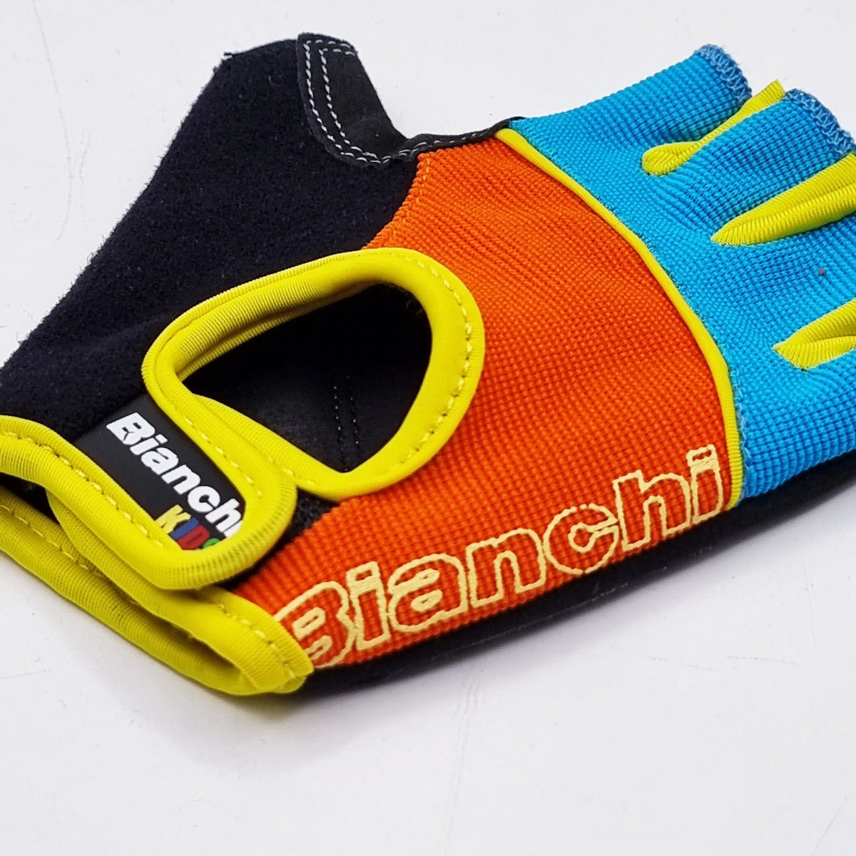 GUANTE BIANCHI NIÑO LIGHT BLUE/ORANGE Bianchi